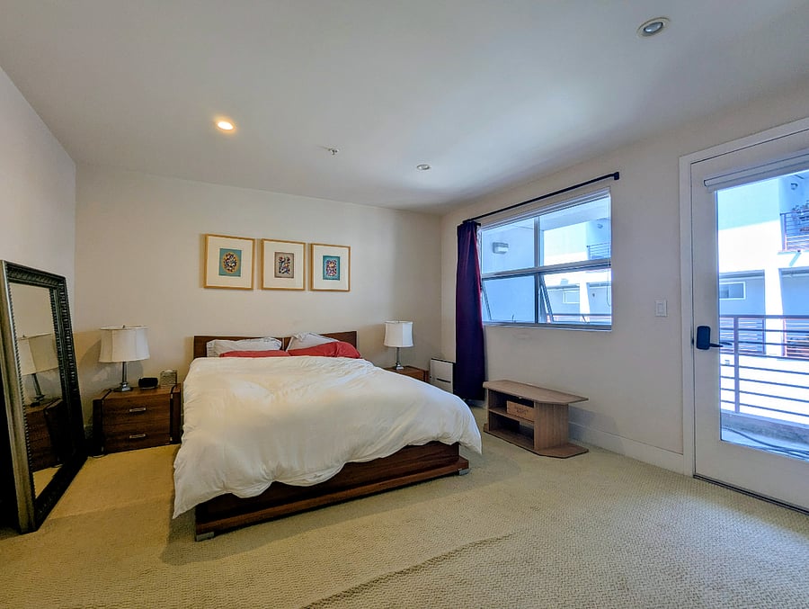 Master bedroom with blackout shades and curtains