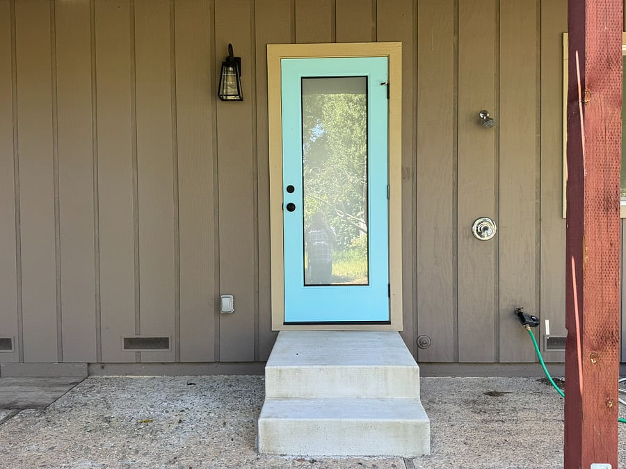 Outdoor hot water shower right outside in back of the house to rinse off after returning from the beach.  Door enters to bathroom.