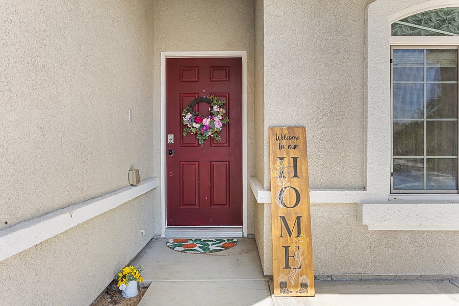Inviting front entry with manicured garden and private entrance
