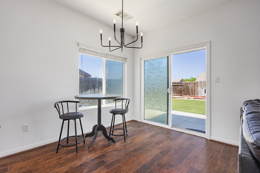 Dining space with scenic backyard views and direct patio access