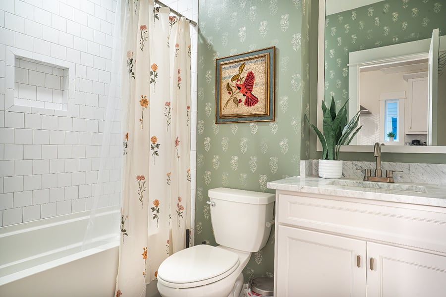 Downstairs bathroom with tub, next to the kitchen and downstairs queen bedroom
