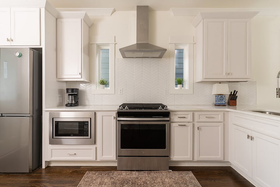 Open-concept kitchen with 12-cup coffee maker and gas stove. Well-equipped kitchen with basic cookware and cutlery and dedicated pantry closet