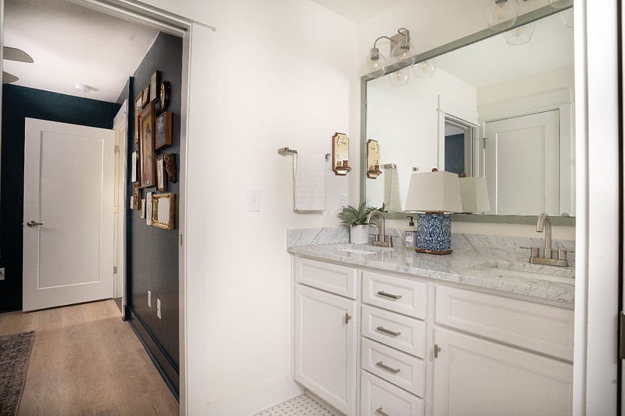 Full bathroom shared by the upstairs queen bedroom and office. Includes double sinks and separate tub and toilet