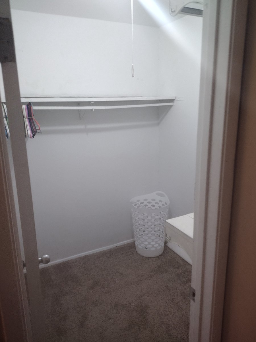 Walk-in closet for master bedroom.