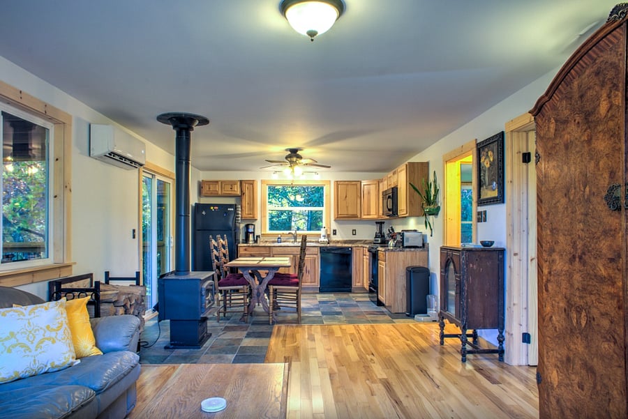 Open living room into kitchen. Mini Split HVAC unit for creature comfort all year long.