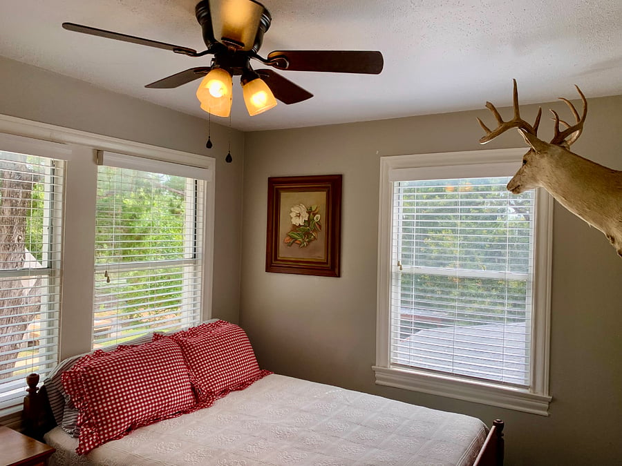 The Cowboy room overlooks the wooded backyard.
