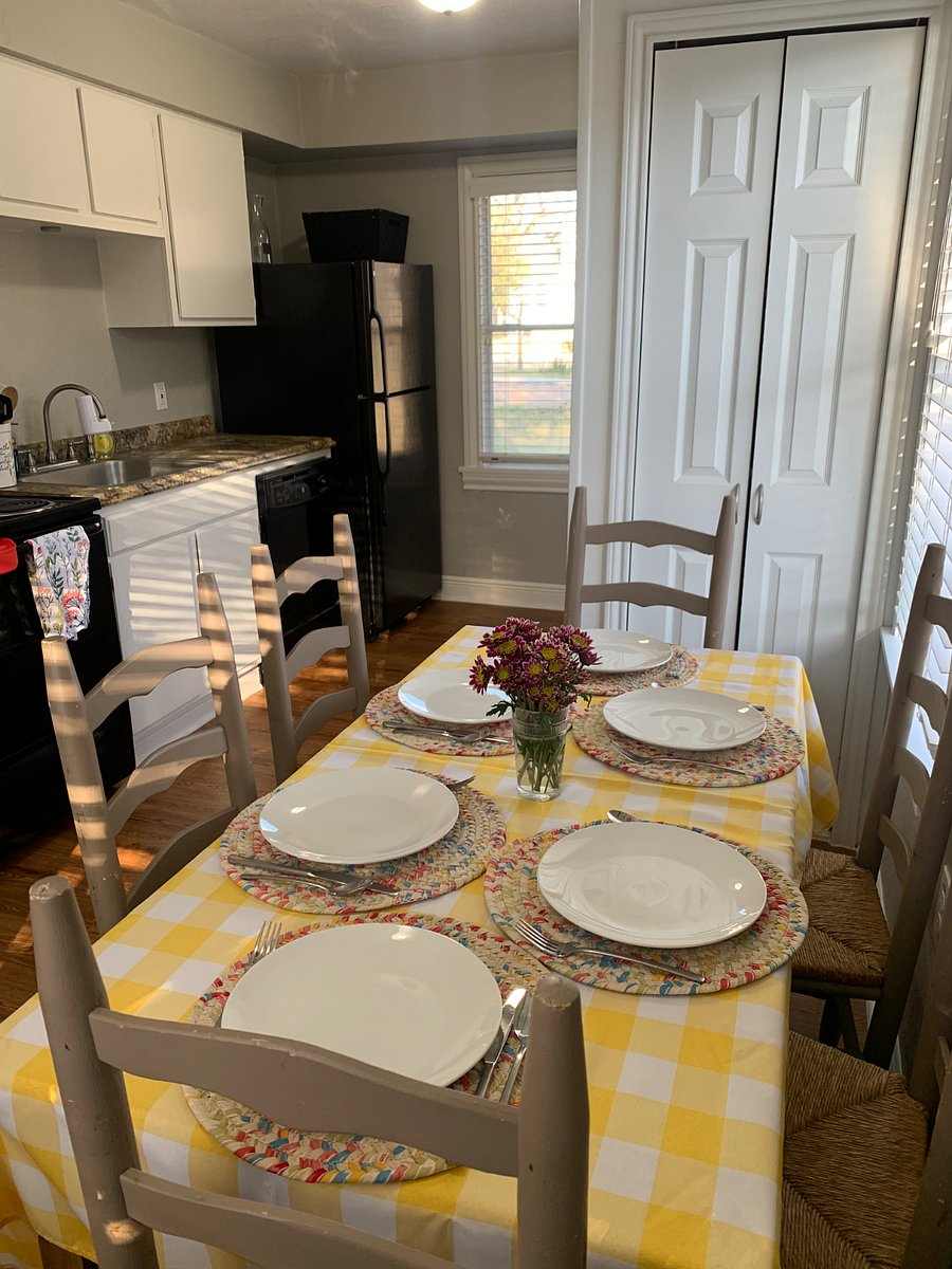 Enjoy meals in our vintage kitchen. An extra pantry stocked with pots and pans is by the stairway.