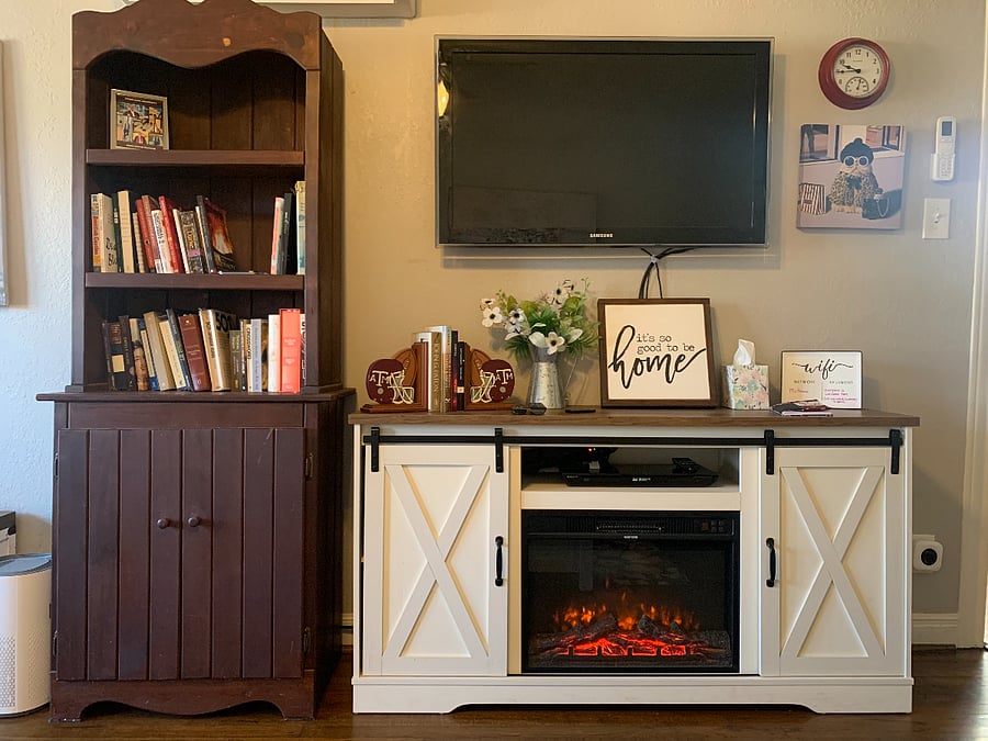 An electric fireplace in the living room make it cozy while you watch your favorite shows. You don't have to turn on the heat to enjoy the cozy atmosphere.