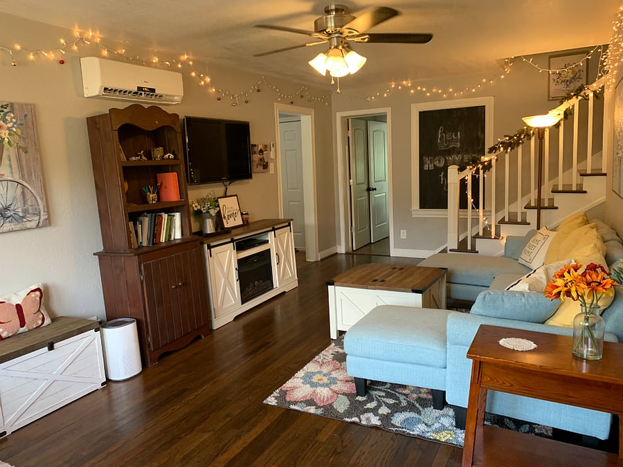 A cozy living room with several places to prop up your feet make a place to relax and unwind.