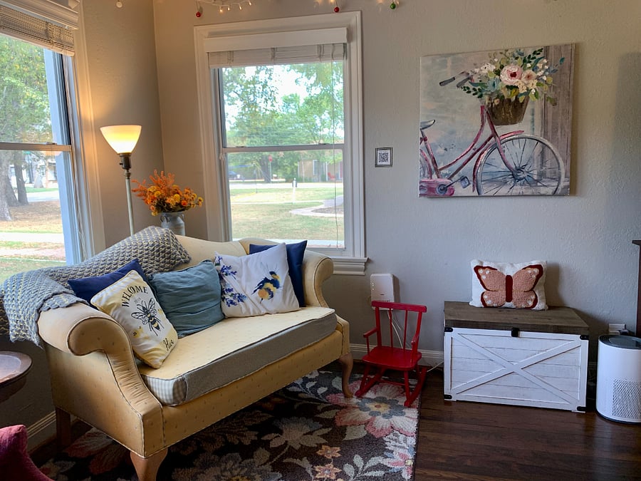 A vintage loveseat in the corner.