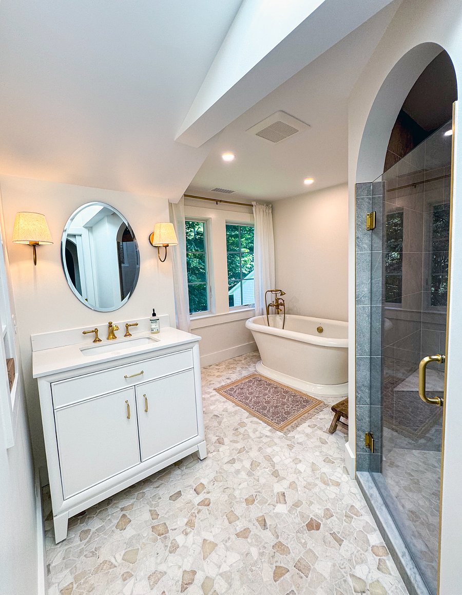 Master bathroom with bathtub and shower