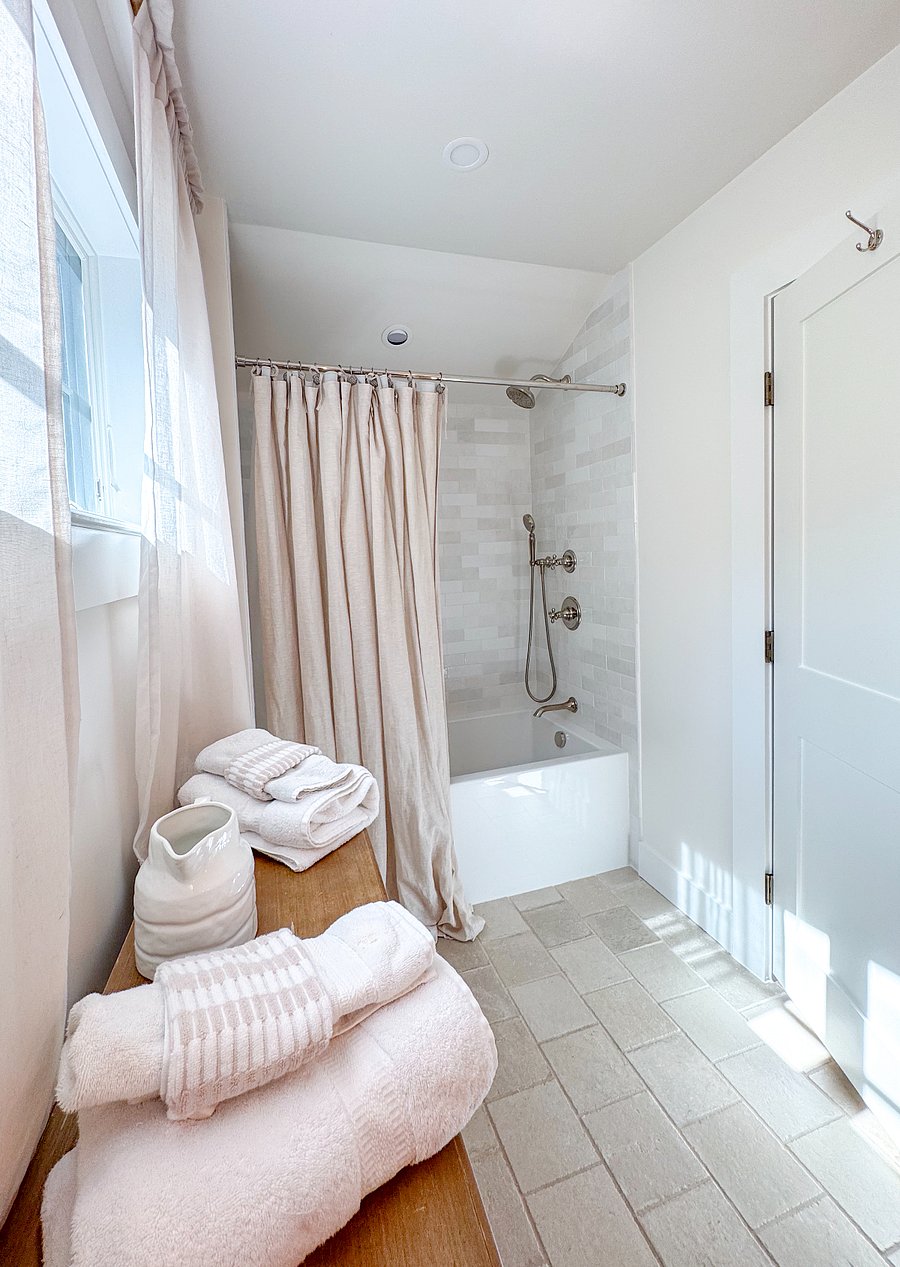 Upstairs full bath with bath tub and shower