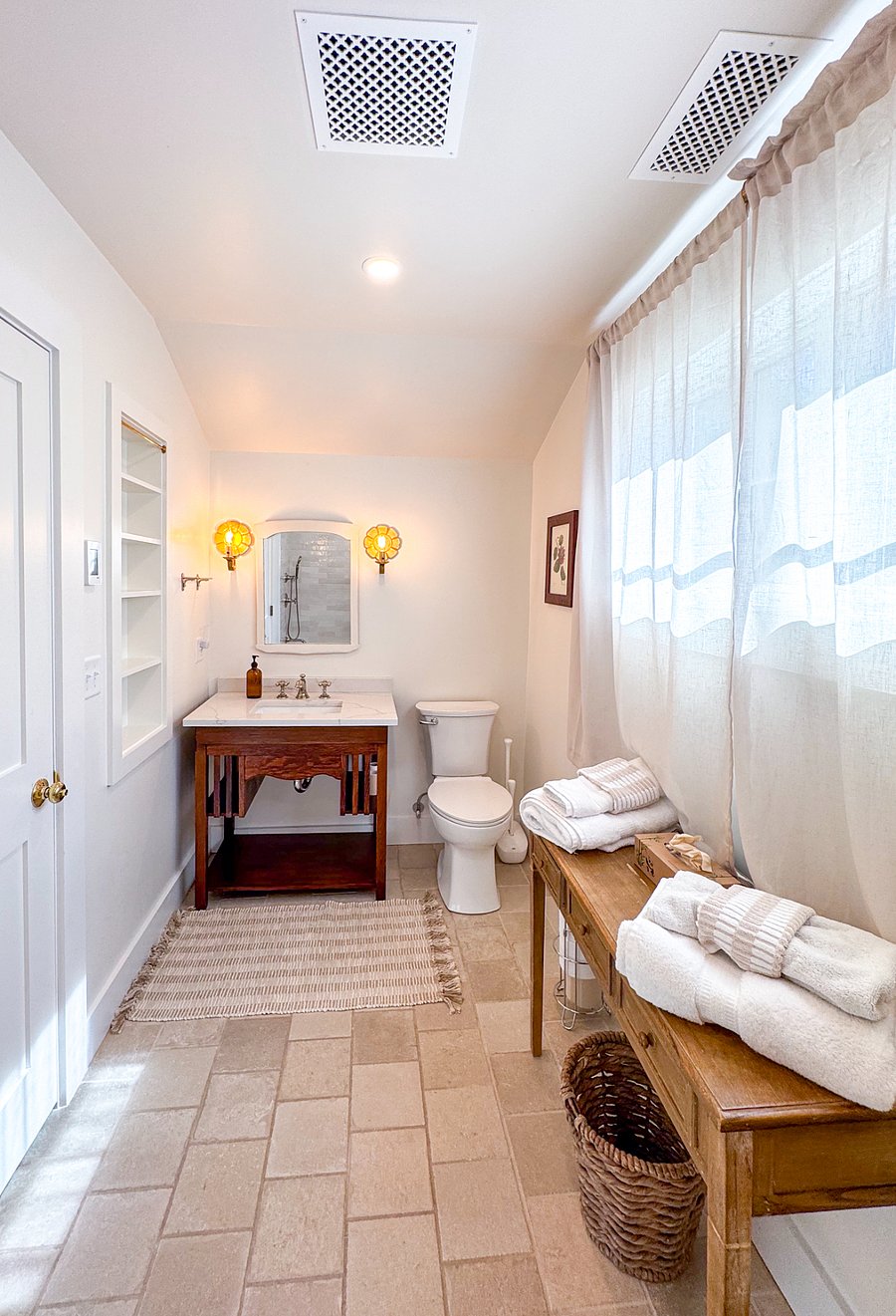 Upstairs full bathroom with bathtub and shower