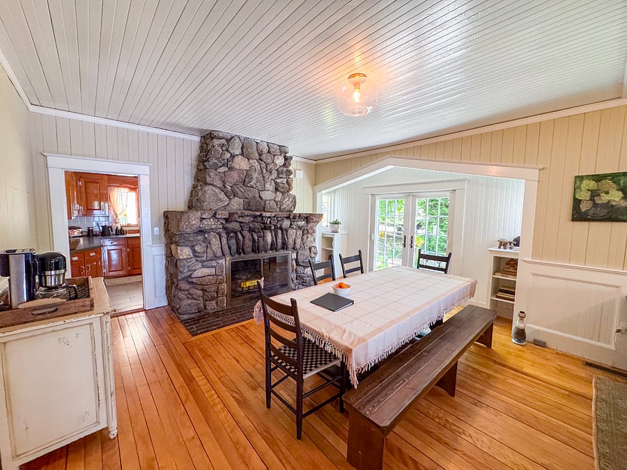 Dining area with original 1905 stone fireplace