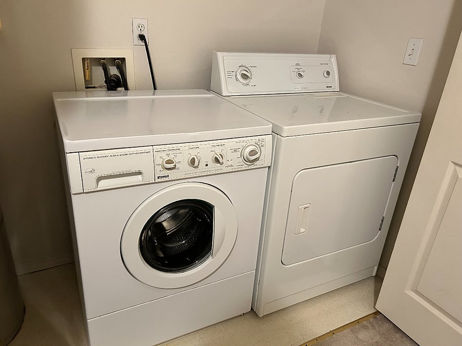 Full size washer and dryer in unit with starter supplies