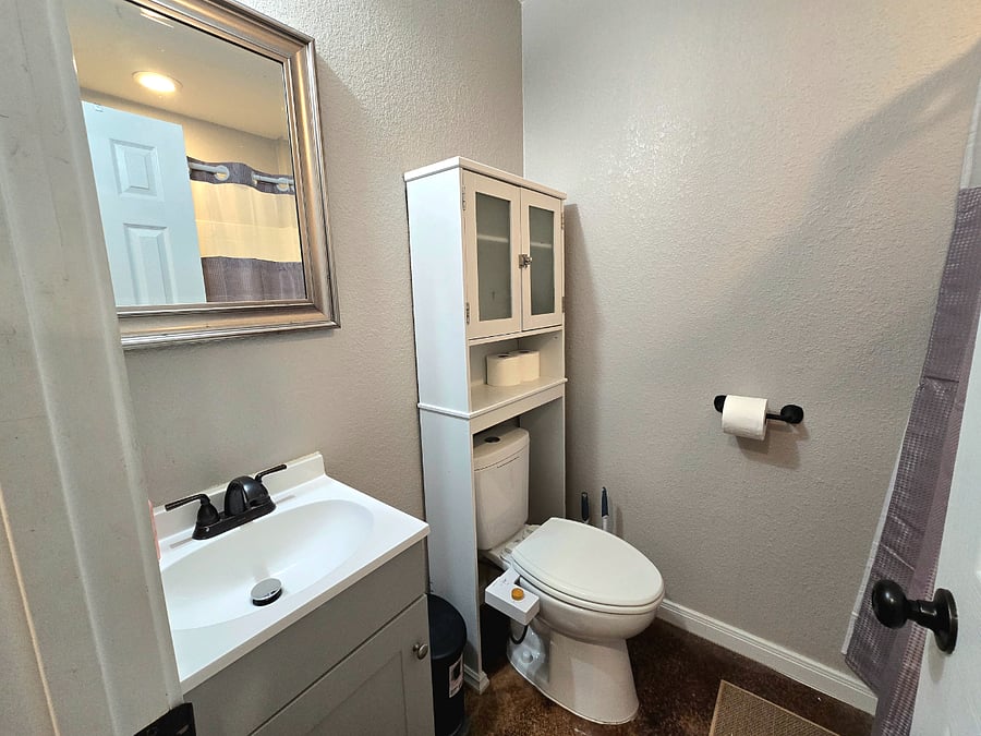 You'll find this soothing bathroom attached to the primary bedroom. The tub-shower invites you for showers or long soaks in the bath.