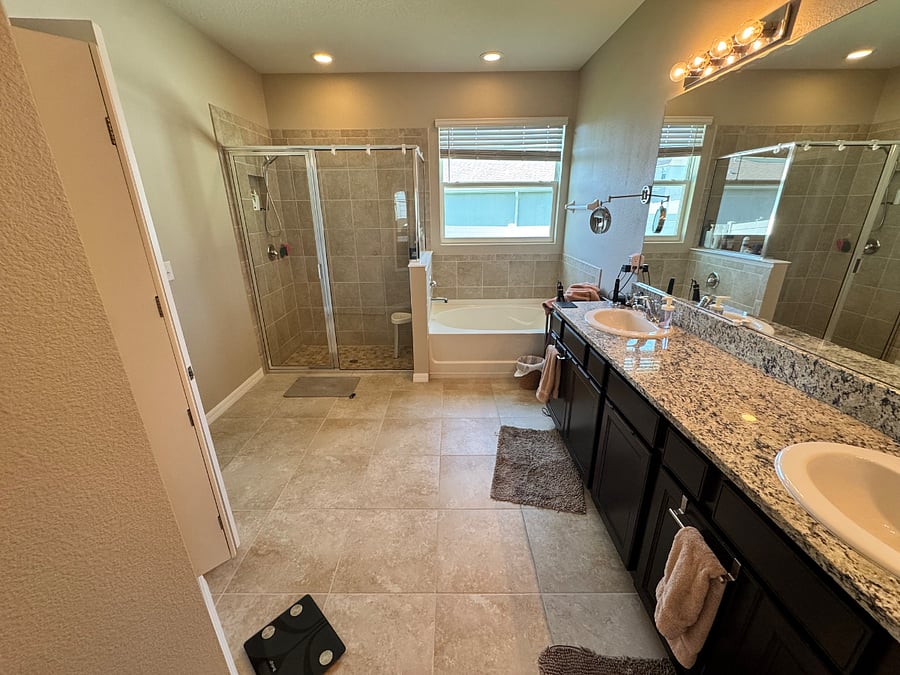 Master bath with shower and soaking tub