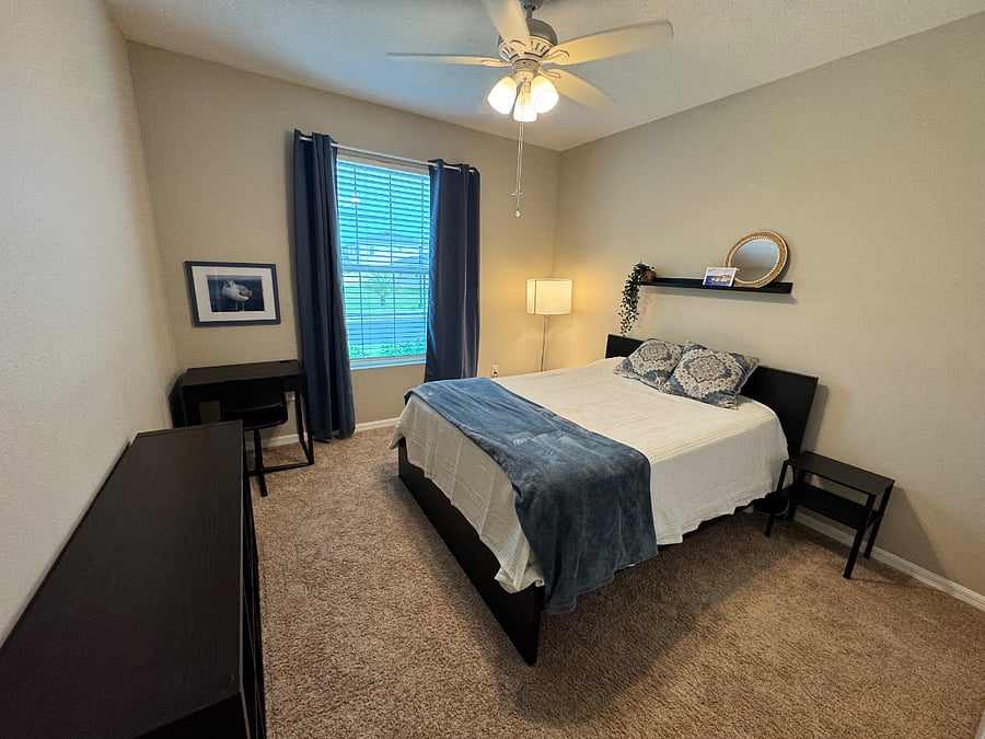Bedroom 4. Queen bed with desk and office chair. 