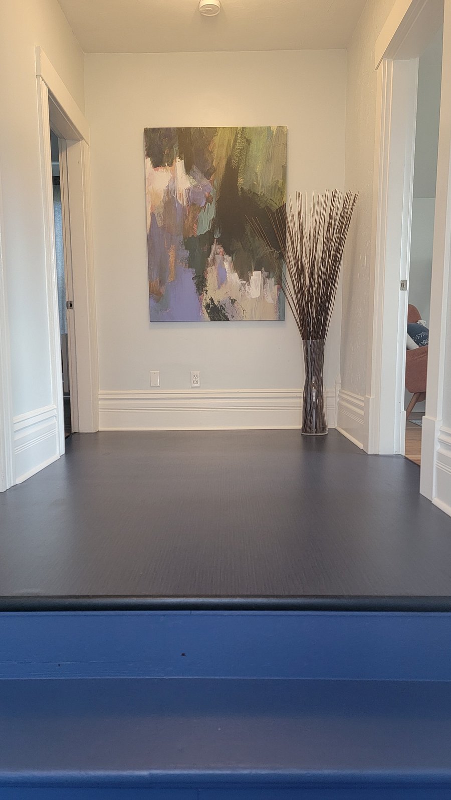 Main interior hallway. Kitchen and bedrooms doors to the left, living room to the right