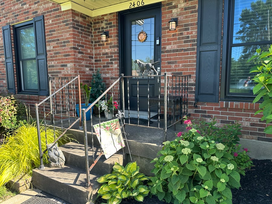 front door with keyless entry and security cameras