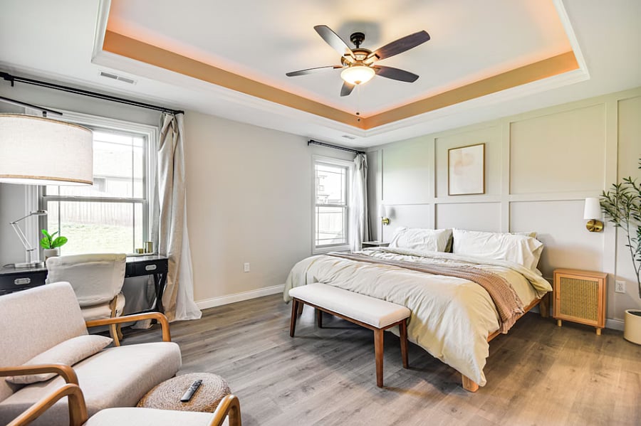 Features en suite bath, walk-in closet, desk, reading chair, and blackout curtains for restful nights or productive days.