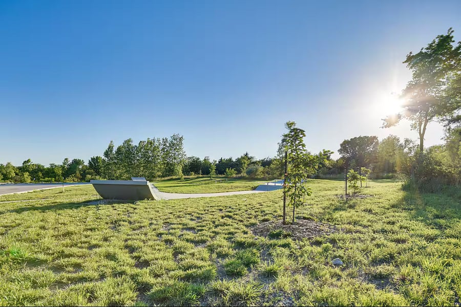 Just a short walk away! Great for kids and petsincludes picnic areas, a basketball court, skate ramp, and baseball field.