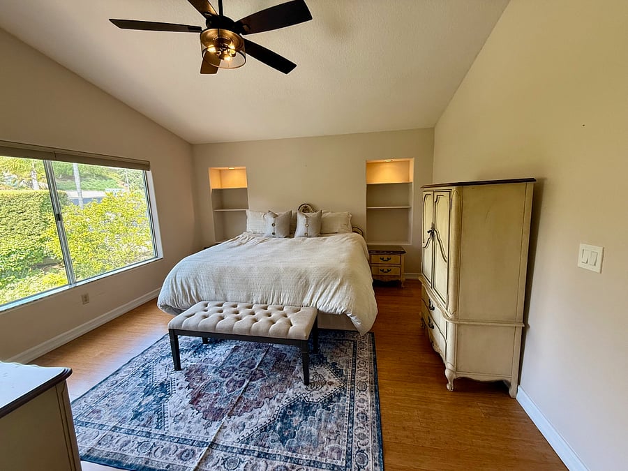 Master bedroom with walk in shower and walk in closets.