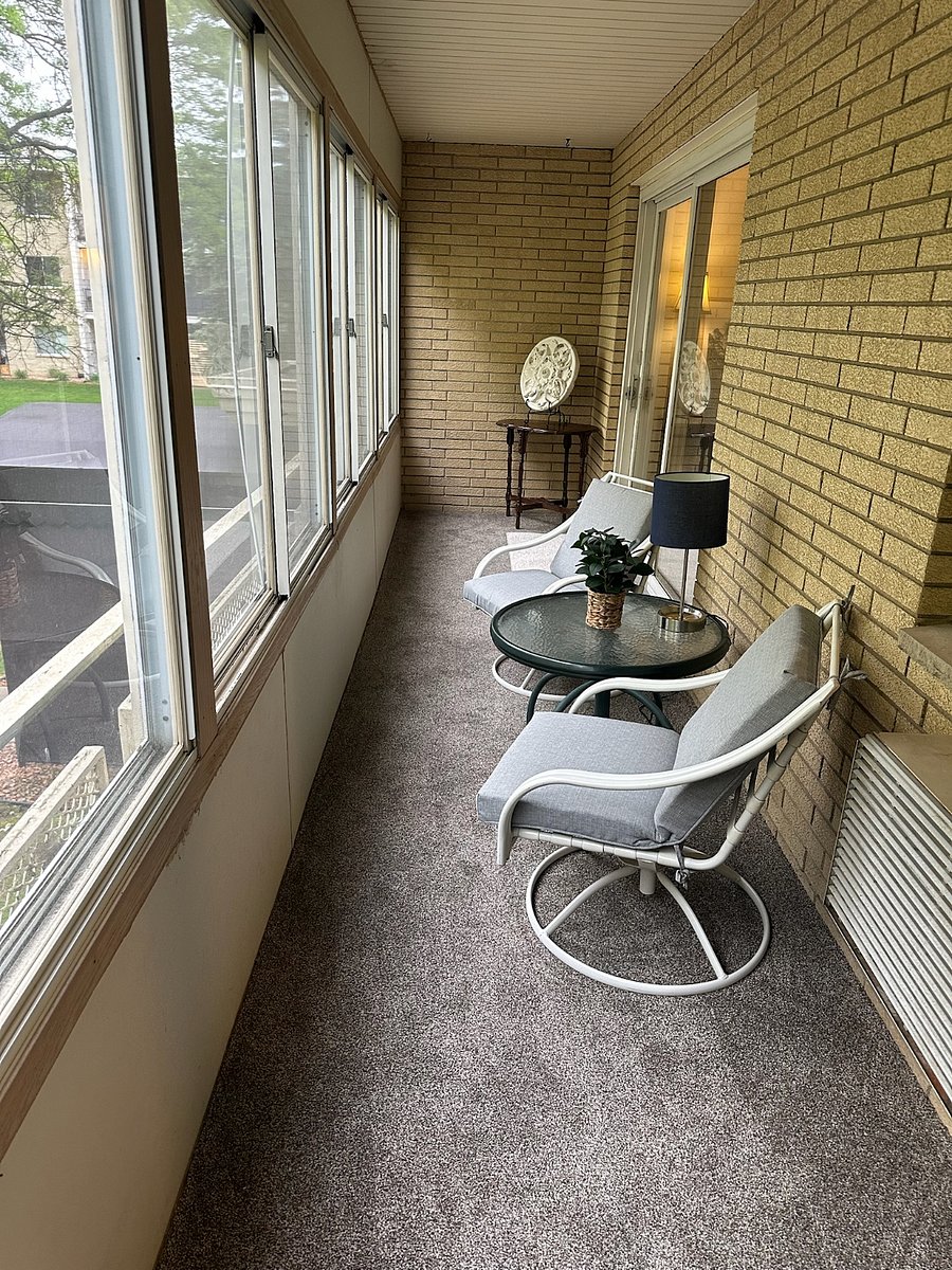 Private enclosed balcony off living room and kitchen