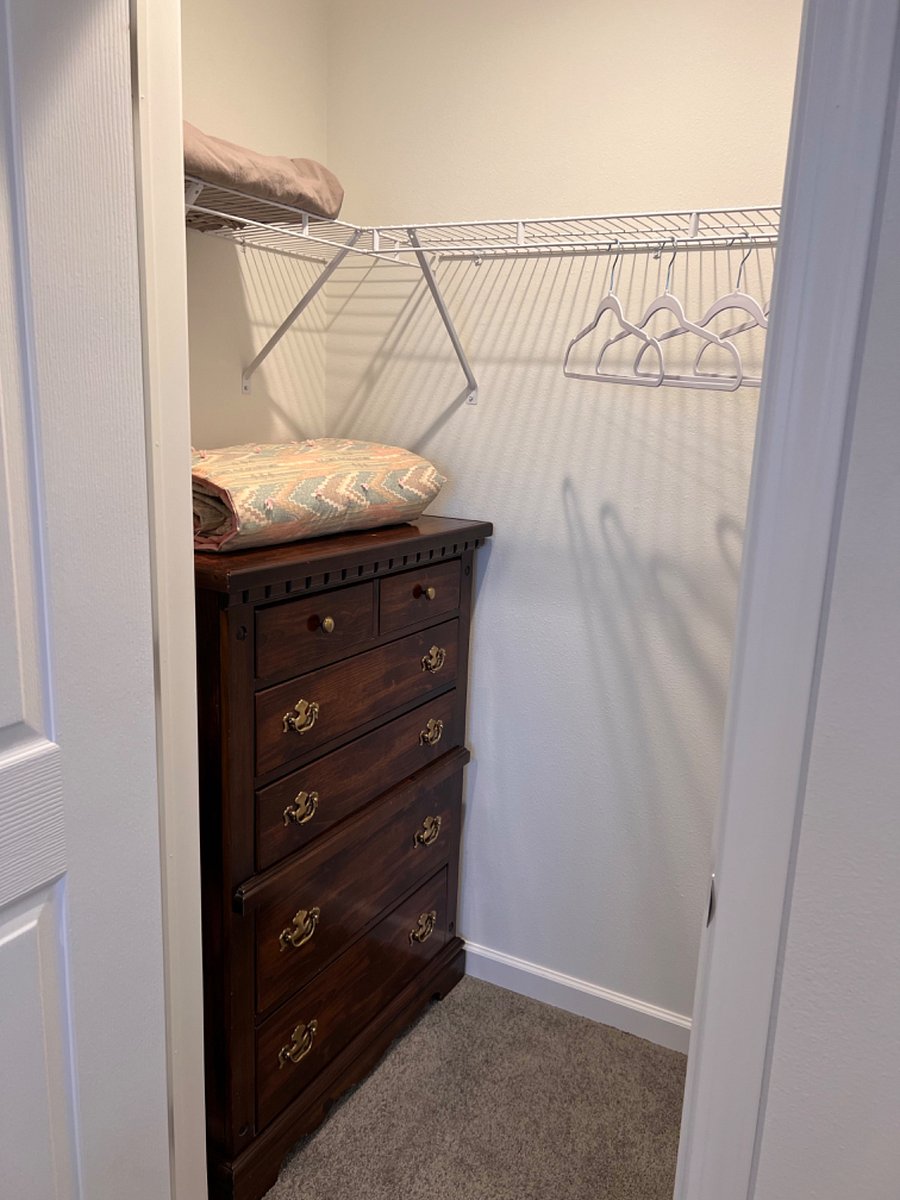 Bedroom 3 closet with dresser.