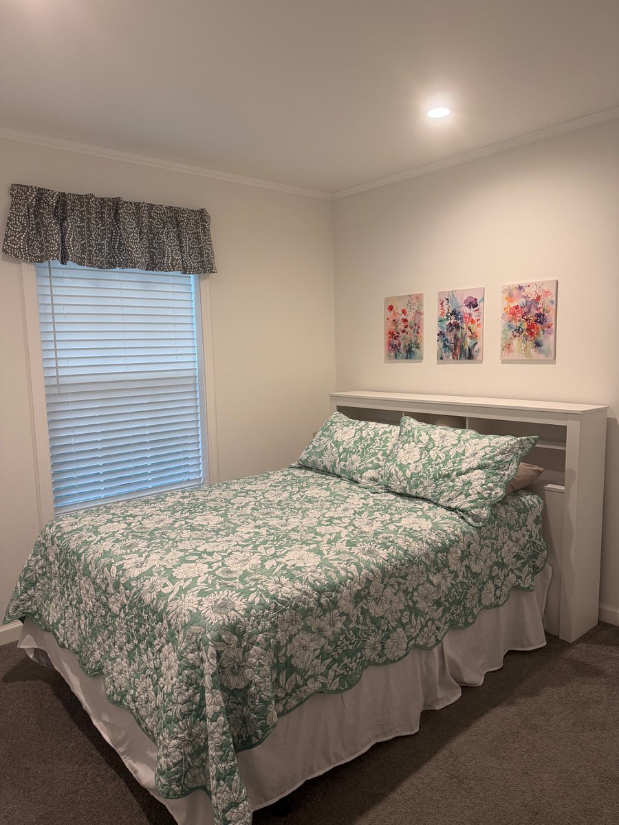 Bedroom 3 with full bed, dresser, and walk-in closet.