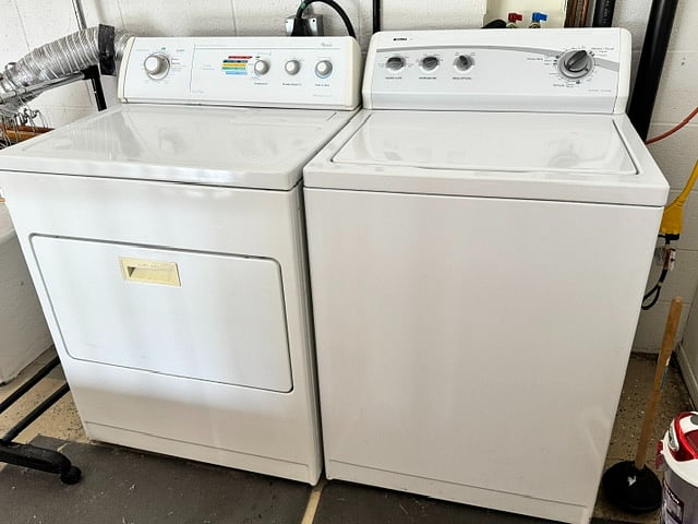 Laundry in garage, just outside door to home.