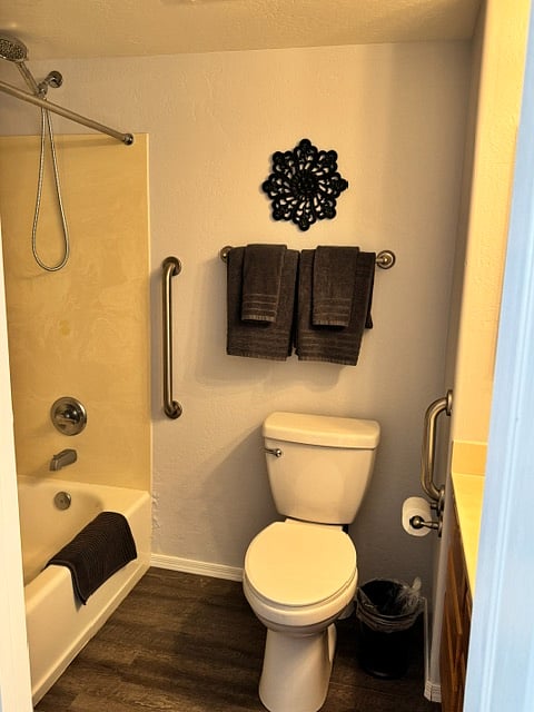 Bathroom with shower/bath combo in back bedroom.