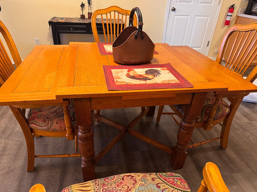 Table has leaves that can be pulled out on the sides.