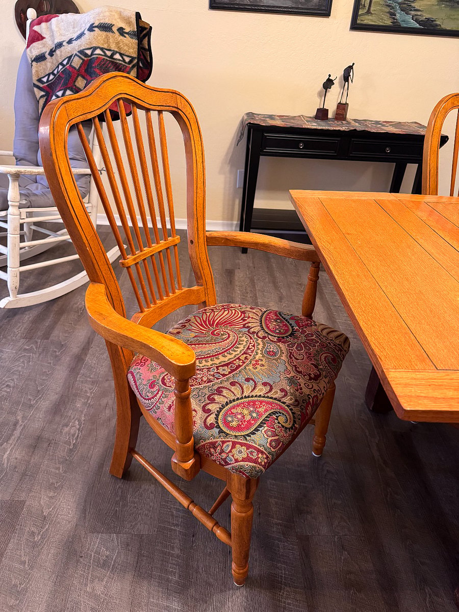 Comfy cushioned chairs with armrests.