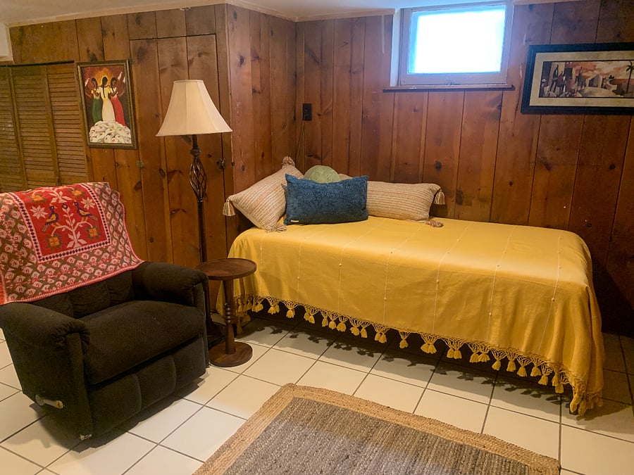 The sitting room has a Lazy-Boy chair and an extra bed in case you have a guest.