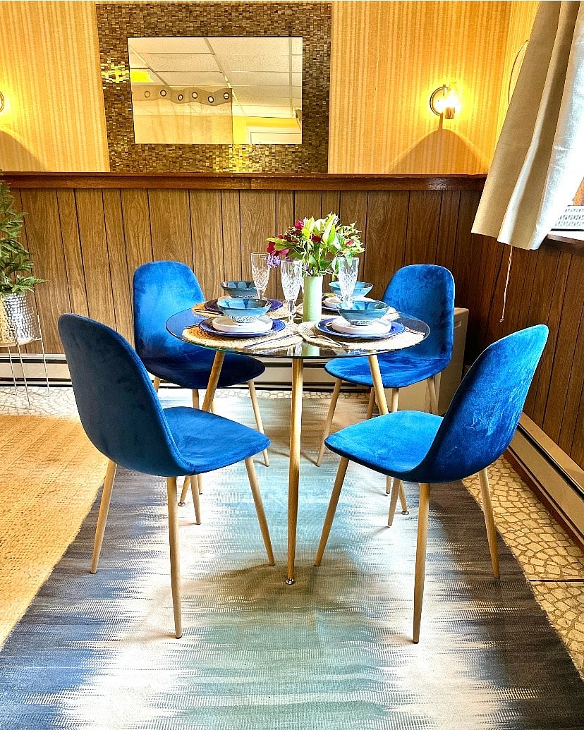 Dining with a view of the garden. A water fountain feature is located just outside of the window.
