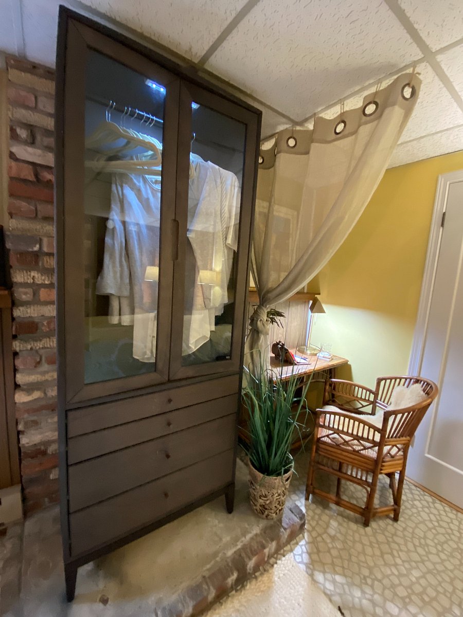 The brown hutch has been converted to a pseudo closet upper with drawers below.