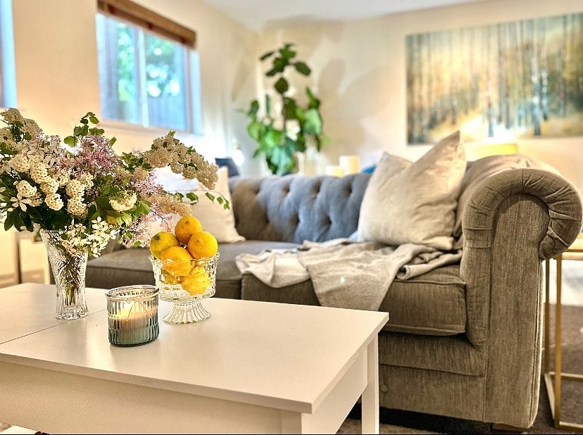This white coffee table opens up to storage areas. The larger section opens up to a perfect lap table height if you prefer dining while watching TV.