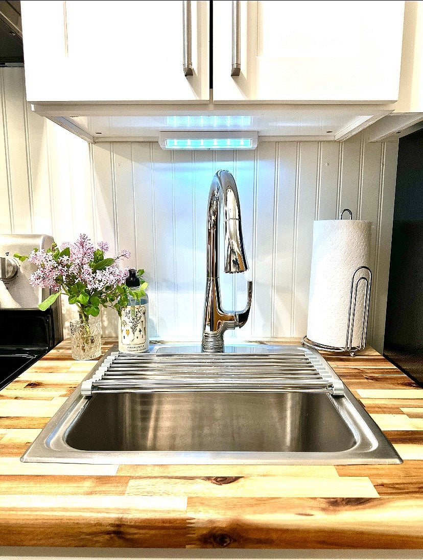 A small dish drain rack can be replaced with a larger one located under the sink.
