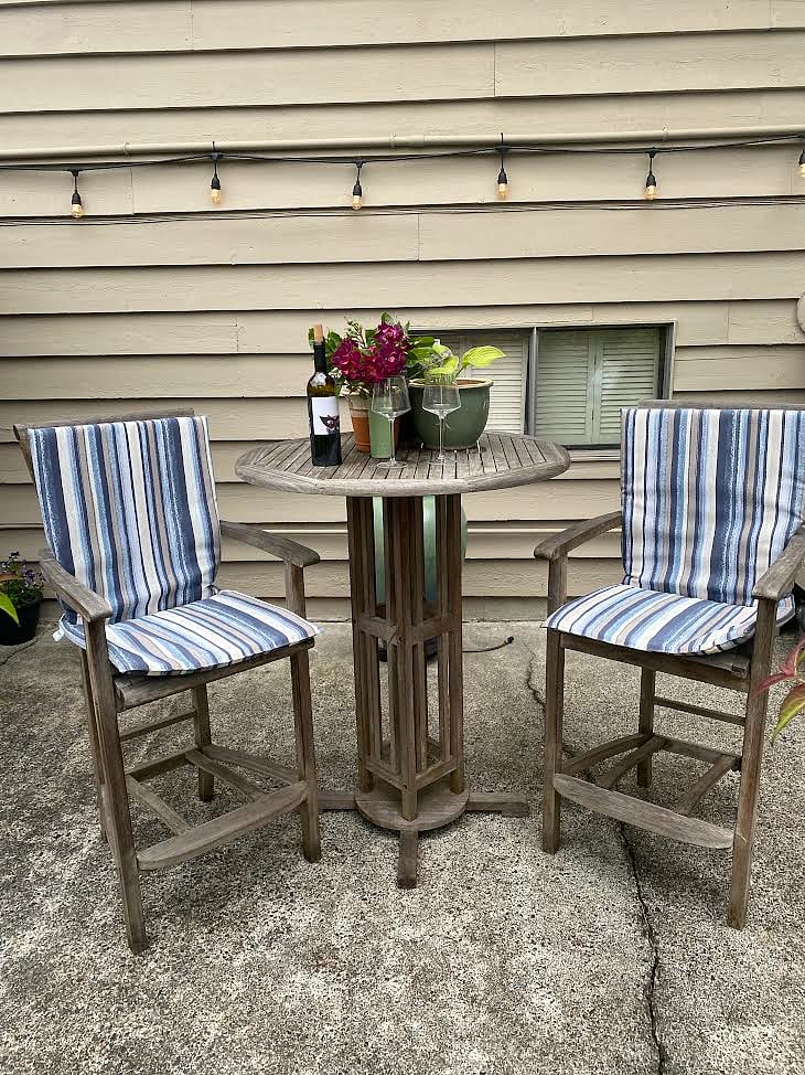 Soak up the sun while sipping a glass of wine and enjoying the garden view at this hightop table and chairs. Also found on the patio just outside of the entrance door.