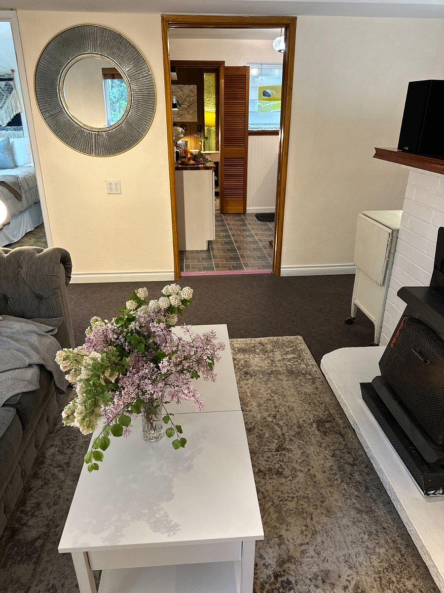 Kitchen is conveniently located between the two bedroom areas.