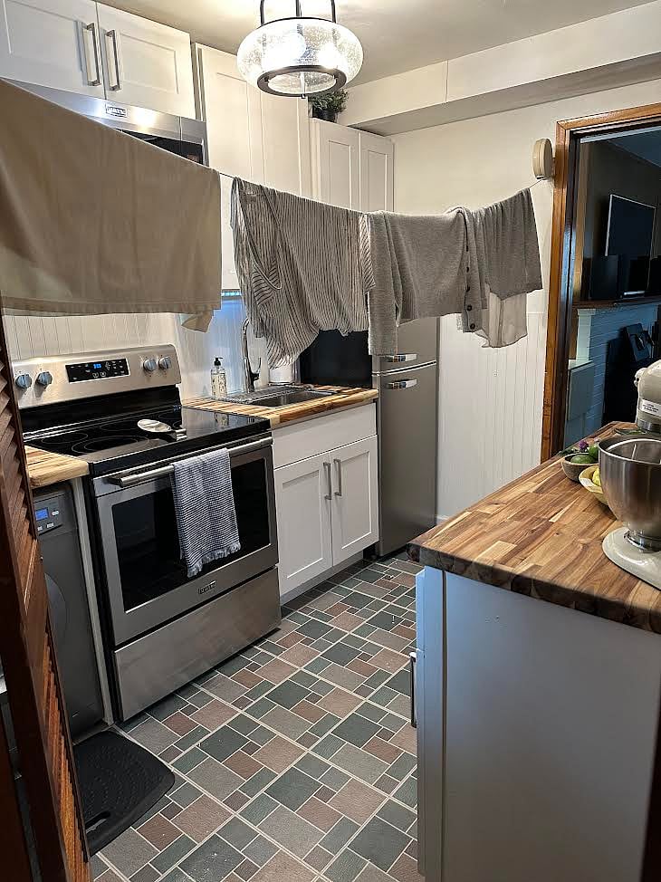 A retractable clothesline can be used to dry your clothes on. Or if it's a sunny day out, we also have a foldable clothesline that could be set out on the patio just outside of the back door.