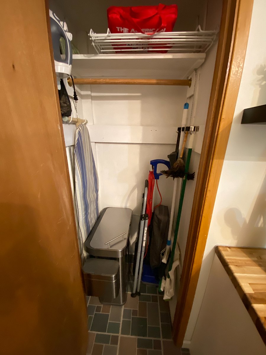 Vacuum, ironing board, iron, garbage/recycle/compost bin all in one handy can along with other cleaning supplies can be found in the kitchen closet.