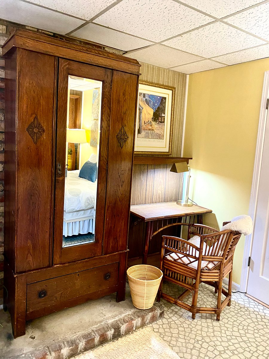 The brown hutch has been converted to a pseudo closet upper with drawers below.