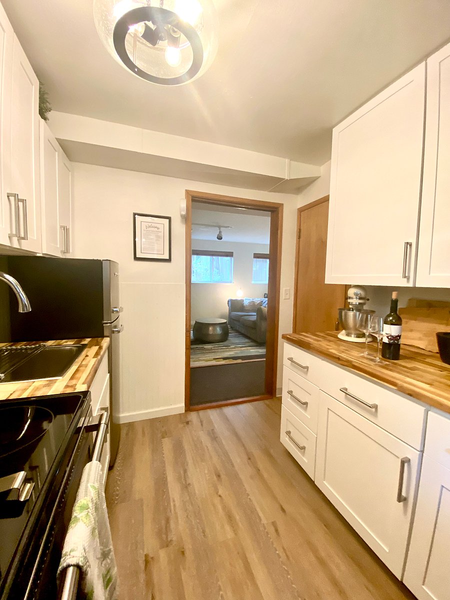 Kitchen is conveniently located between the two bedroom areas.