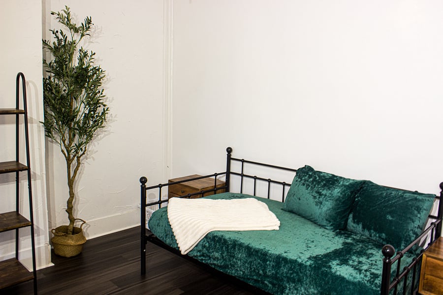 Second bedroom with cozy twin-size bed  ideal for guests or roommates.