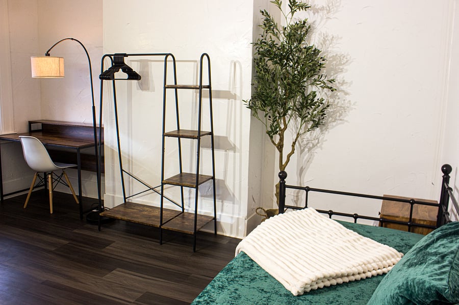 A second dedicated workspace with hanging closet for extra space. 