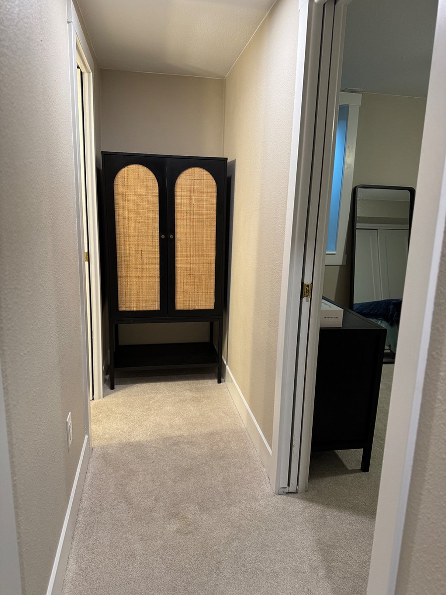Linen storage & hallway to private bathroom & bedroom.