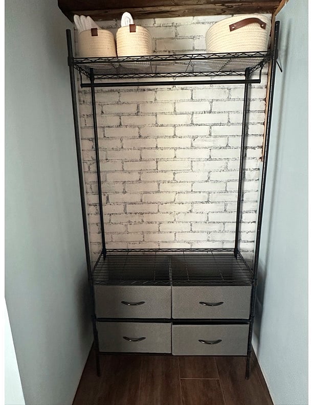 Hanging rack with drawers in bathroom for storage, clothing, etc.