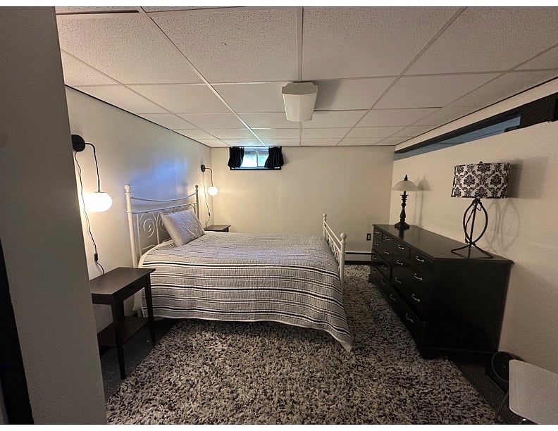 Spacious bedroom with full size bed.